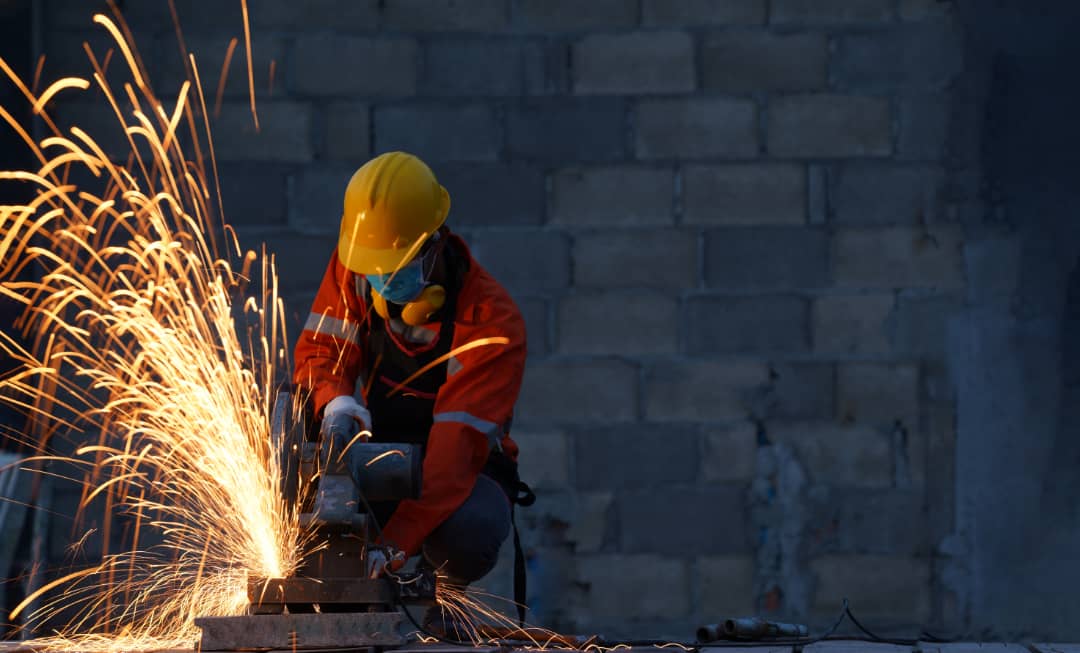Worker grinding metal with sparks — Mechanical Engineering Craft