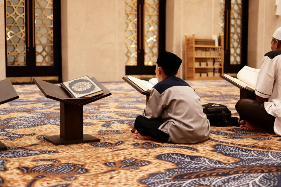 Students studying the Holy Quran