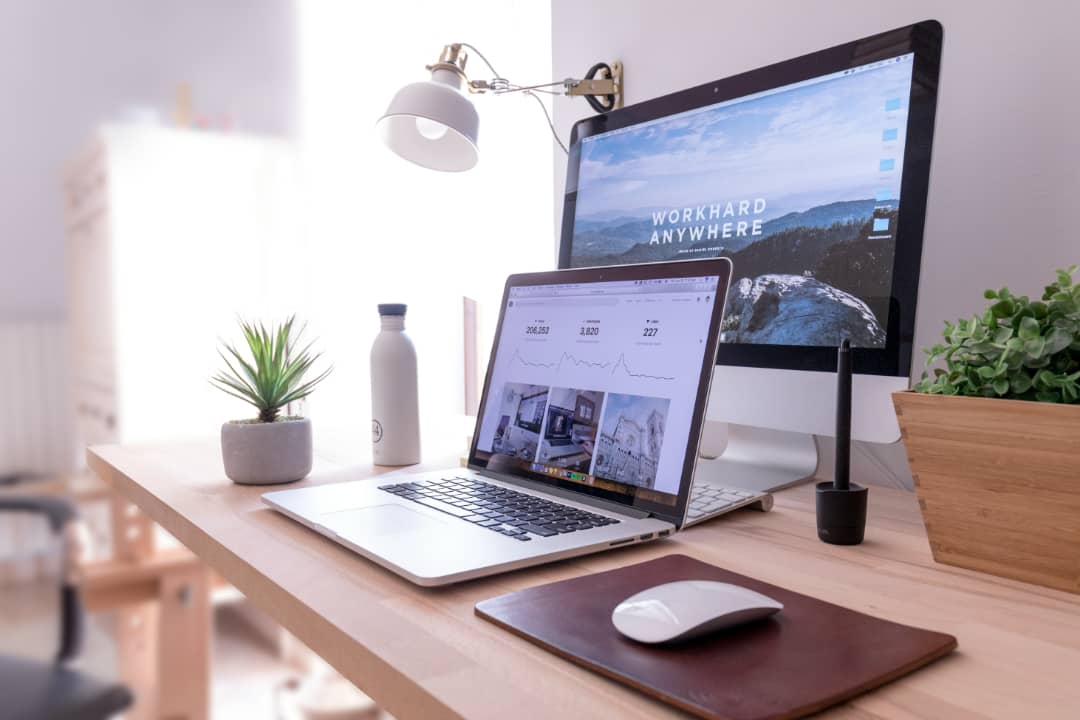 Clean modern home office setup — work from anywhere as a Virtual Assistant